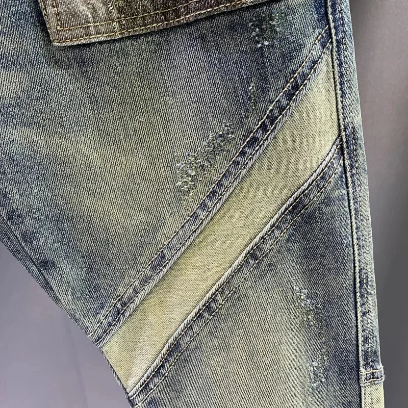 Primavera e outono 2026 nova marca na moda emenda remendo retro jeans calças masculinas fino ajuste pés pequenos rascal bonito denim