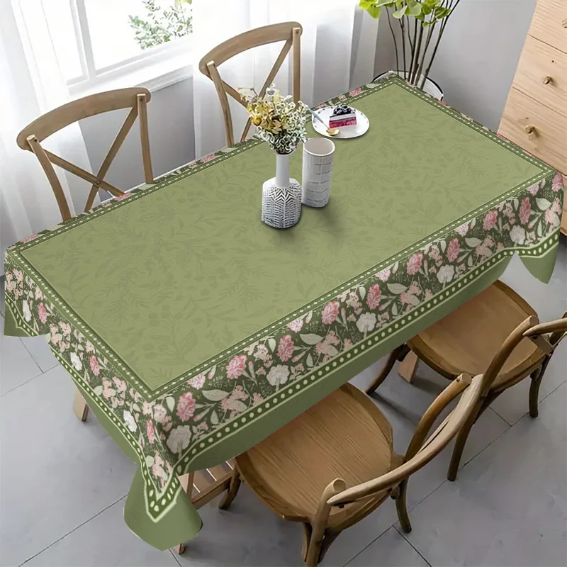 The tablecloth with a green background and pink flowers conveys a fresh and rural style.