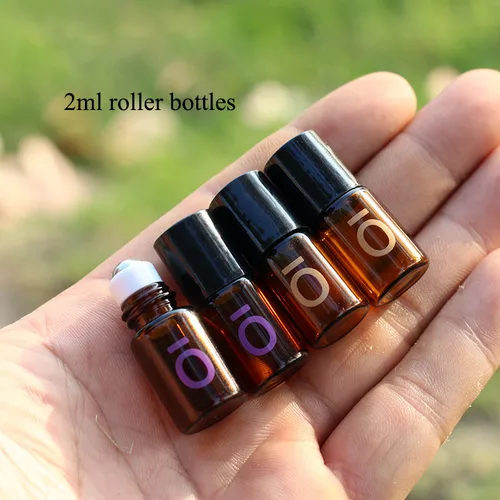 Mini botella de vidrio ámbar con bolas de acero inoxidable, botella enrollable vacía de aceite esencial, viales de 2ml, 30 unidades, 50 unidades