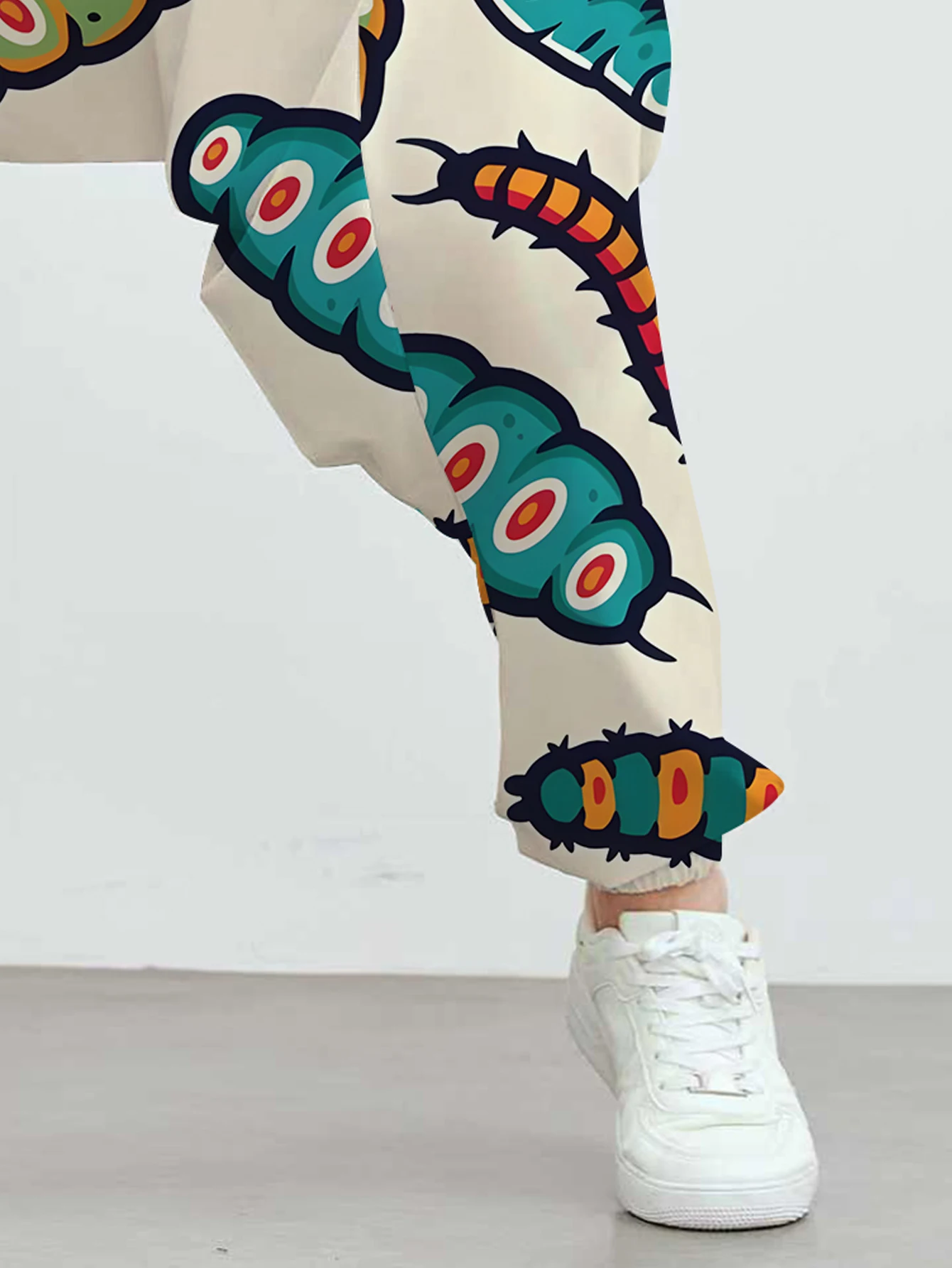 Men's ankle-length pants, featuring a cute caterpillar print, with a unique and fashionable pattern design. view 2