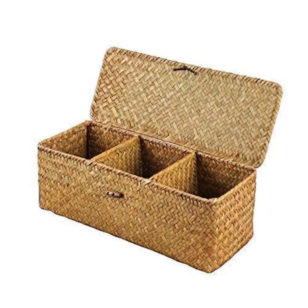 Set of three hand woven storage baskets with lids