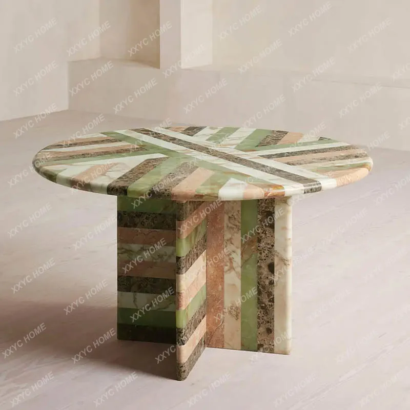 A  minimalist round marble dining table light luxury stone modern simplicity high sense creative design dining table