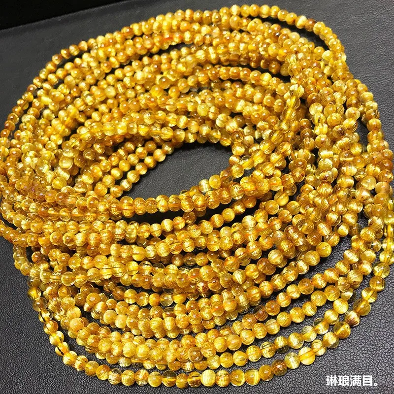 Natural multi-loop bracelet with plate titanium, golden rutilated quartz, yellow crystal, cat's eye stone, 108