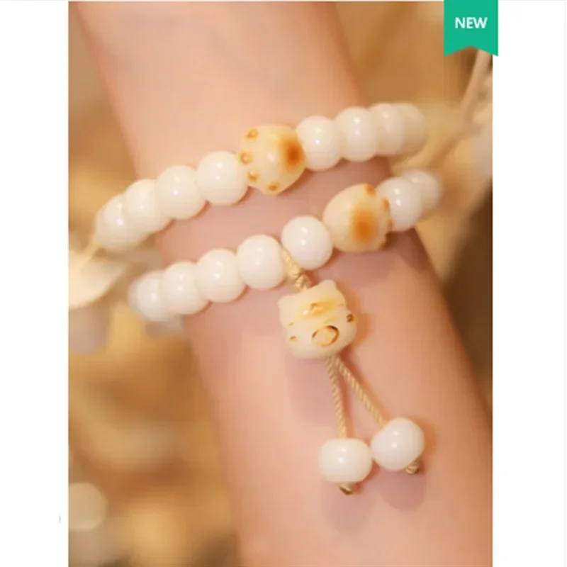 

Cat milk bean charcoal burning cat paw Bodhi root natural white jade hand string text play bracelet girl women bangle gift retro