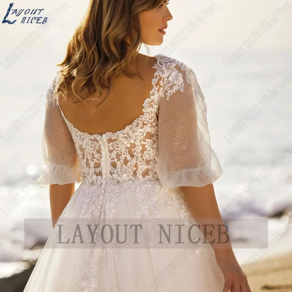 LAYOUT NICEB V-hals Plus size trouwjurk halve pofmouw A-lijn bruidsjurk backless appliques Tulle robe de mariee luxe 2024LAYOUT NICEB V-hals Plus size trouwjurk halve pofmouw A-lijn bruidsjurk backless appliques Tulle