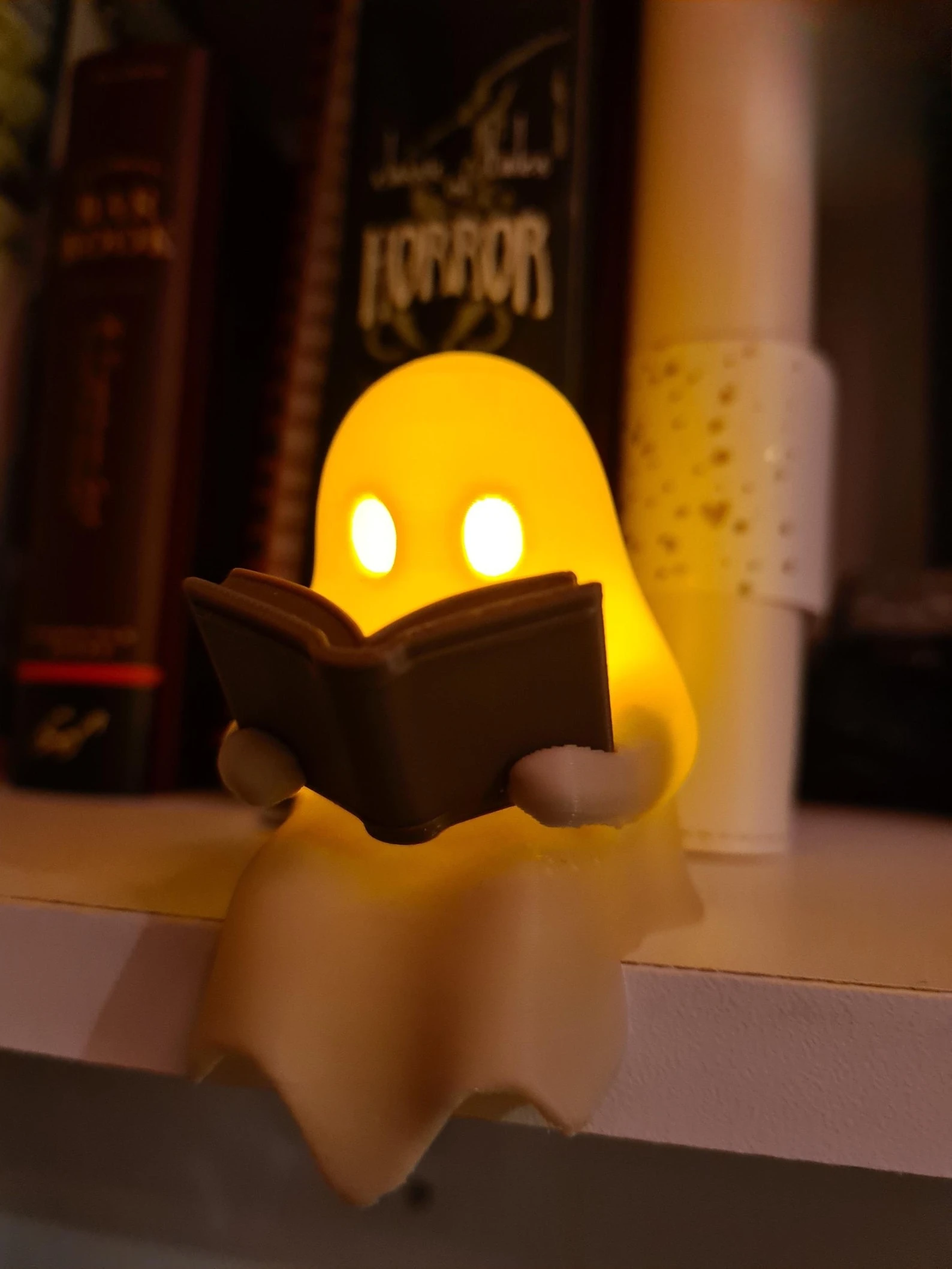 Halloween Party Decoration Favors Cute Little Ghost Sitting on A Shelf Reading A Book with Flickering Ornament Gift Spooky Idea view 2