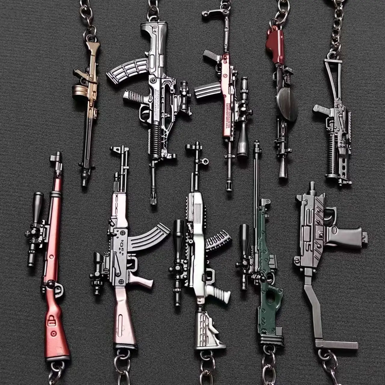 Mini-Spielwaffen-Legierungsmodell-Schlüsselanhänger, verschiedene Gewehrformen, Metall-Schlüsselanhänger, Taschenanhänger, nicht funktionsfähiges Sammlerstück.