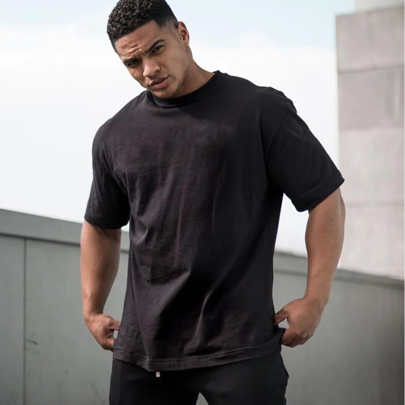 Einfarbige übergroße T-Shirts aus Baumwolle mit tief angesetzter Schulter, lockere Kurzarm-Fitness-Shirts für Herren, Sommer, Fitnessstudio, Bodybuilding, Sportbekleidung