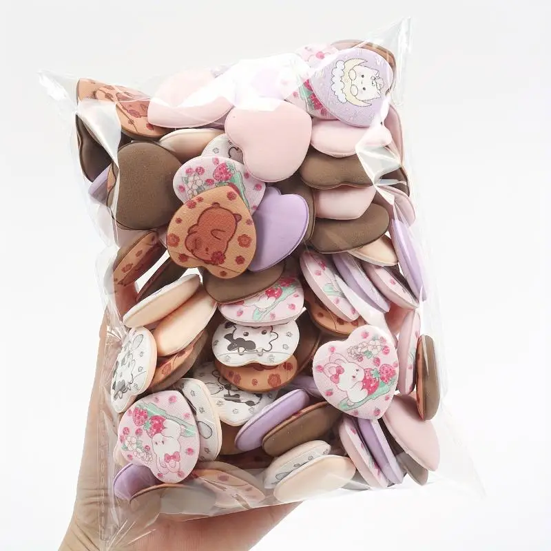 10 stuks bedrukte hart mini-vingerpoederdonsjes - water uitbreidbaar nat en droog tweeërlei gebruik voor make-up cosmetica-toepassing
