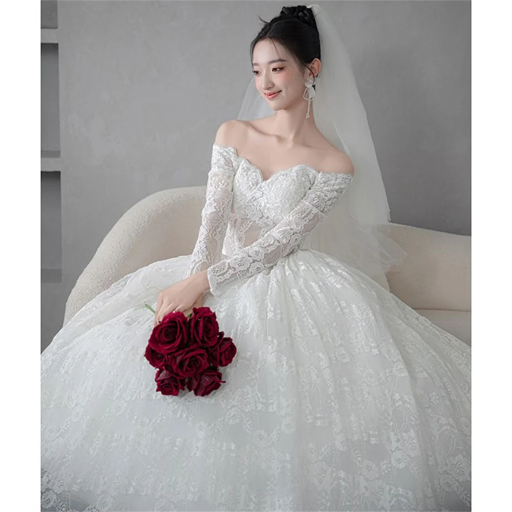 

Elegant New Romantic Lace Long Sleeve Wedding Gowns Boat Neck Robe Sexy Illusion Back Wedding Dress Customized ﻿A056