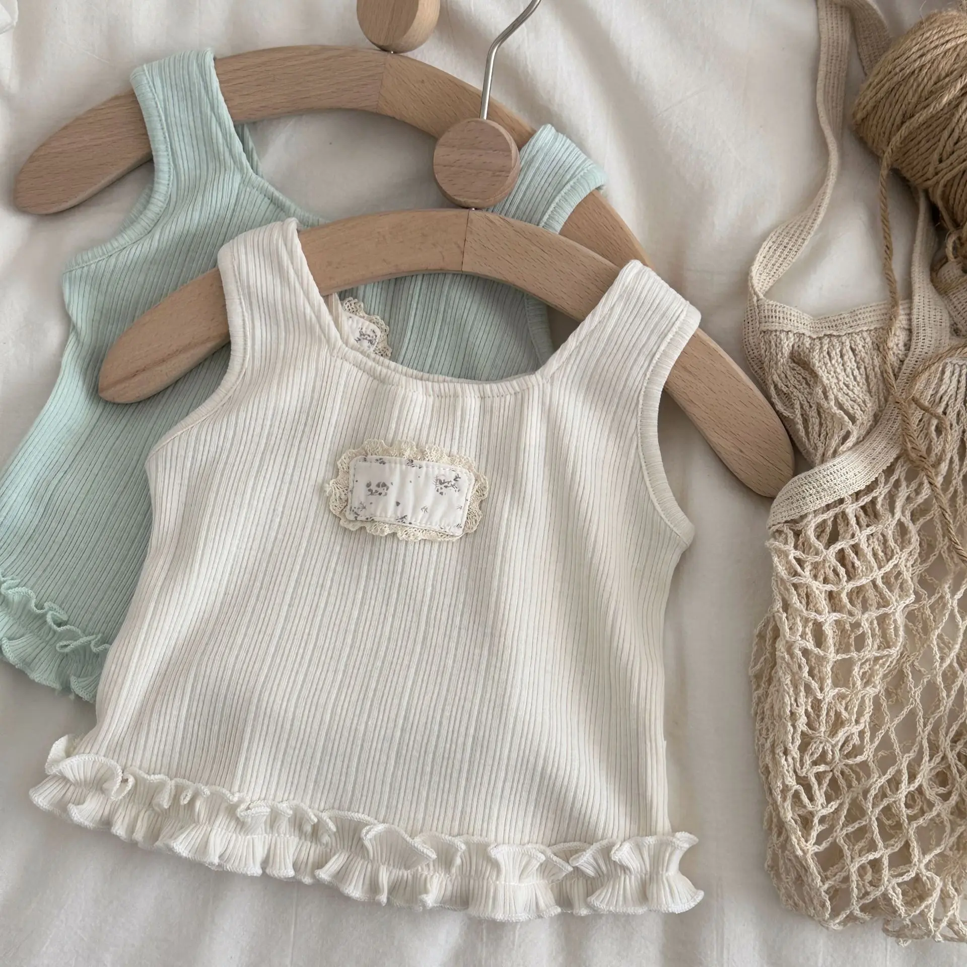 

2026 Summer New Baby Sleeveless T Shirts Cotton Girls Cute Floral Patch Vest Solid Toddler Sweet Lace Tops Infant Clothes