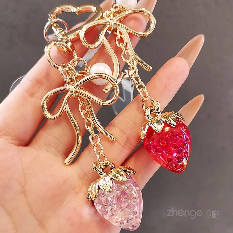 

Minimalist Luxury Transparent Strawberry Charm - Bow Pearl Lanyard, Versatile Anti-lost Keychain for Phones & Bags
