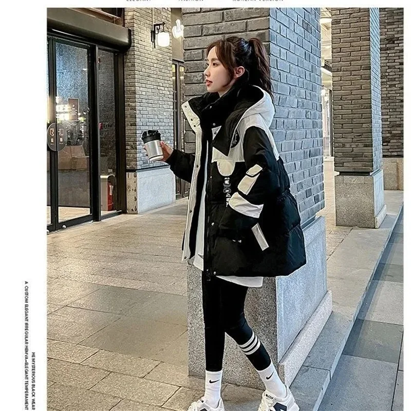 Chaqueta de algodón Parker negra de longitud media para mujer, nueva versión coreana 2026, abrigo con capucha de algodón suelto y empalmado, cálido para invierno.