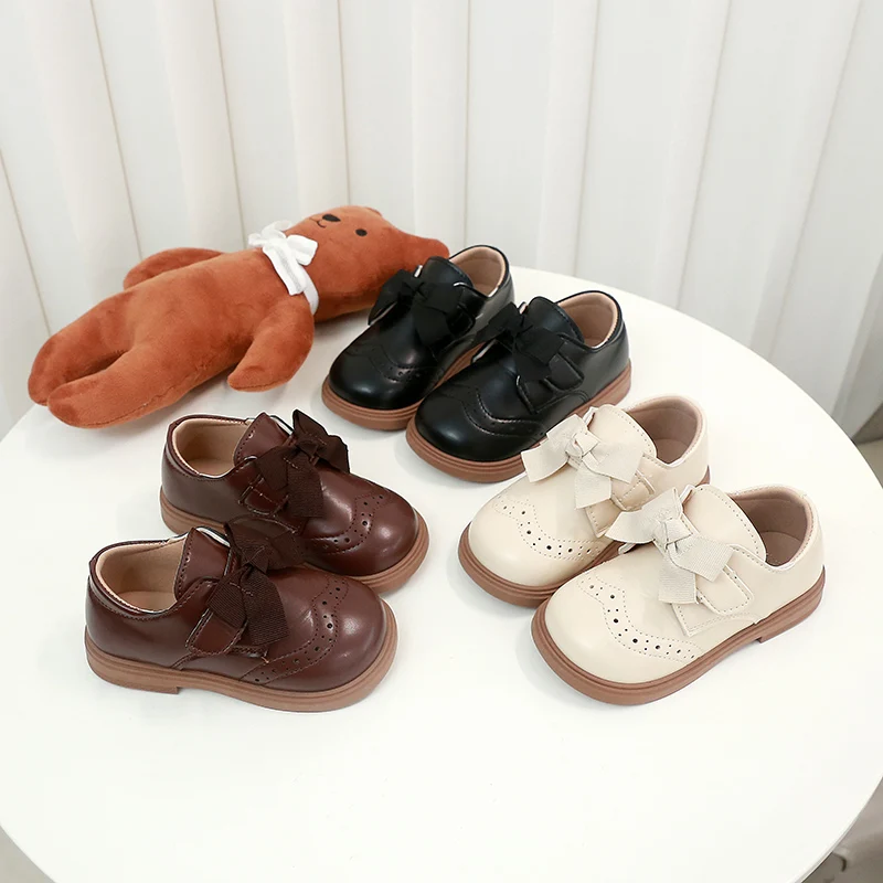 สาวรองเท้าหนังหวาน Bows เด็กเจ้าหญิงรองเท้า Retro สไตล์อังกฤษ 2025 เด็กใหม่แบนรองเท้า Soild สีลื่น