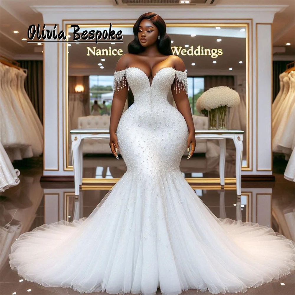 Newfangled Off The Shoulder Wedding Gowns For Women 2025 Bride Luxury Beads Crystal Tassels Mermaid Aso Ebi Style Customized