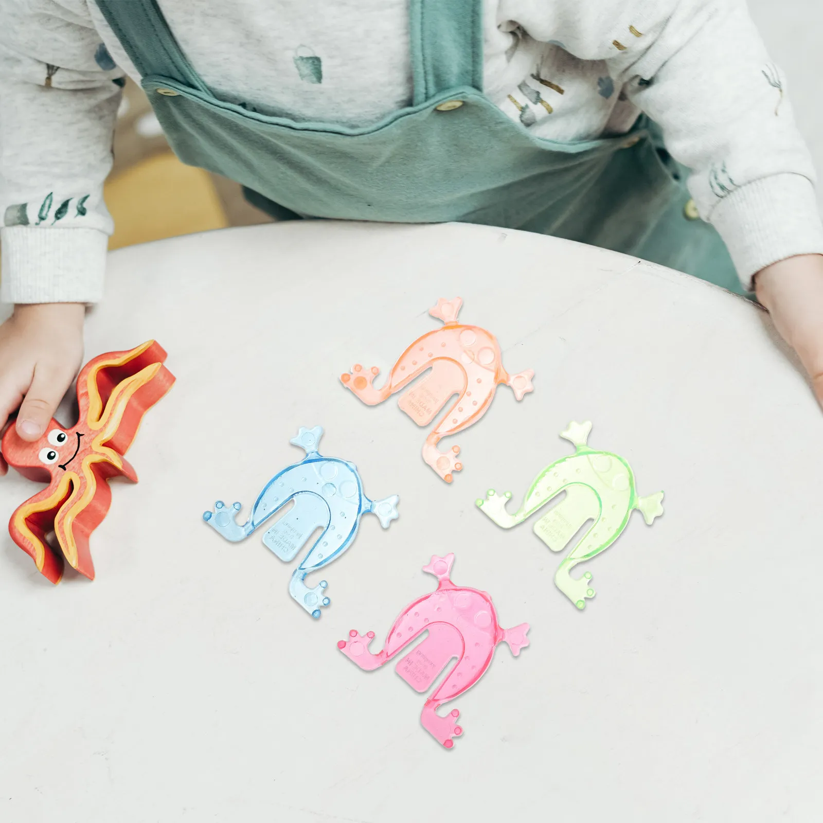 

100Pcs Mini Spring Jumping Frogs Press Tail to Leap Fun Finger Activated Kids Party Favors Birthday Carnival Gifts Random Colors