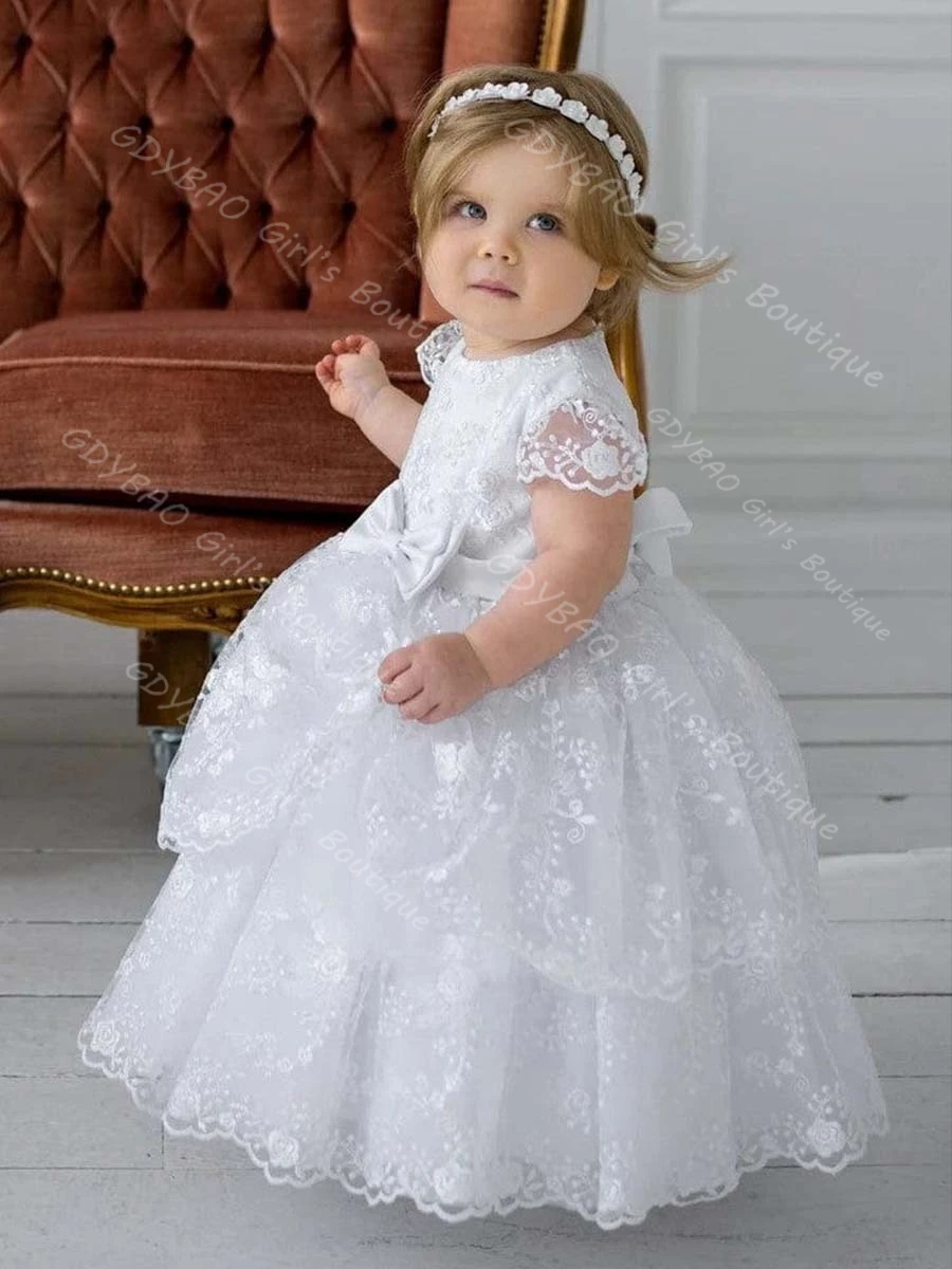 فستان التعميد من الدانتيل المتدرج للأطفال الصغار بأكمام قصيرة وشاحات على شكل فيونكة فستان التواصل المعمودي 0-6T للأطفال مخصص على شكل زهرة للفتيات فستان الحفلات