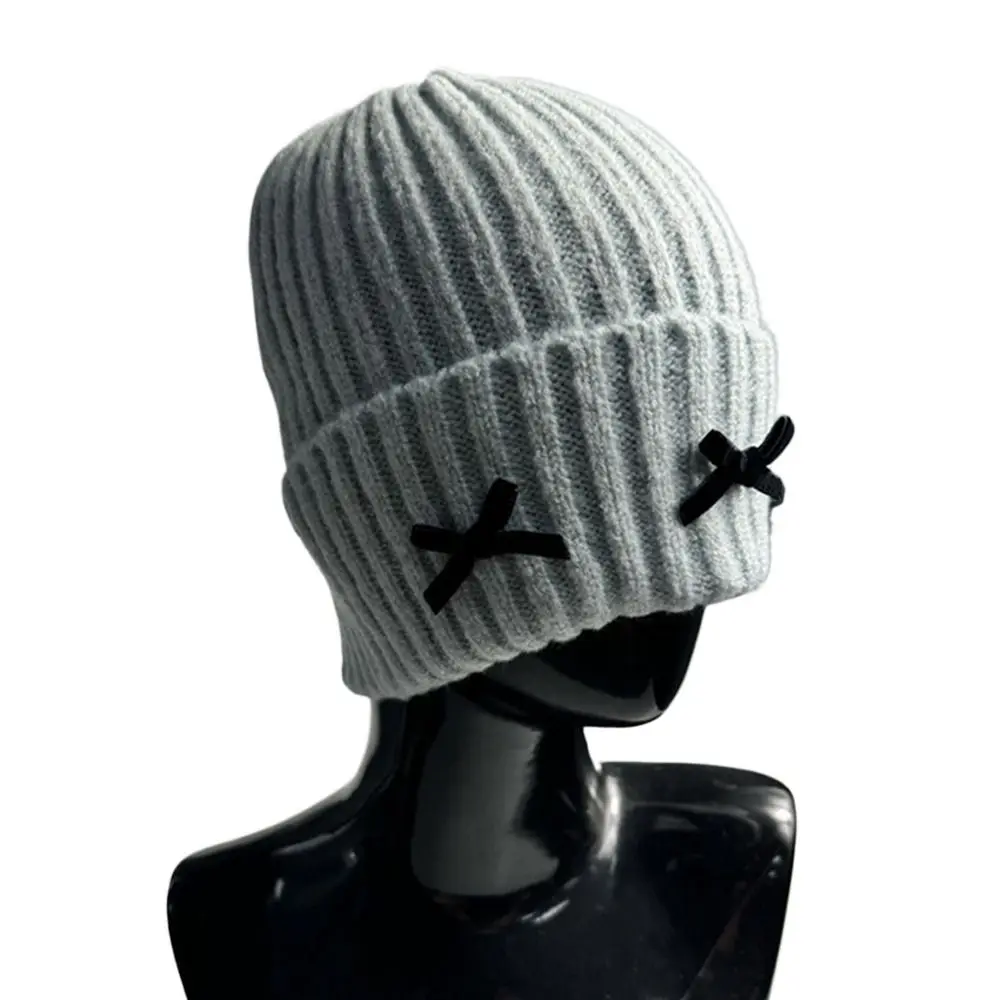 قبعة شتوية محبوكة بفيونكة سميكة وناعمة قبعة صغيرة كاجوال لطيفة للأذنين للنساء