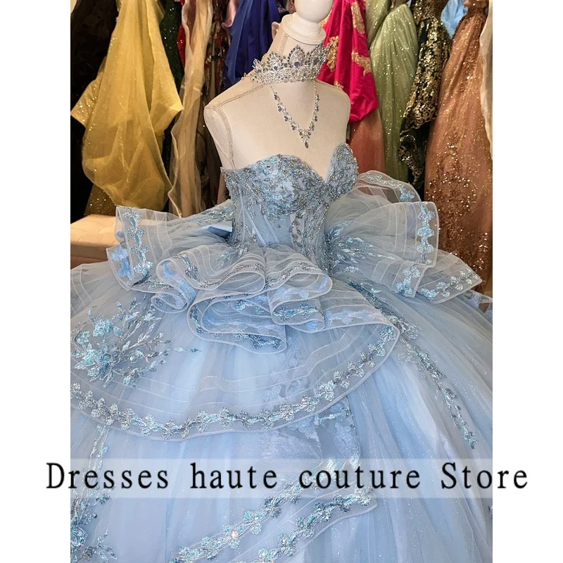ชุดเดรสสีฟ้าอ่อนสำหรับงาน Quinceañera แบบไม่มีแขน แต่งลูกไม้ผูกเชือก ผ้าทูลล์  ชุดเดรสสำหรับงาน Quinceañera ปี 2026  สามารถสั่งตัดได้