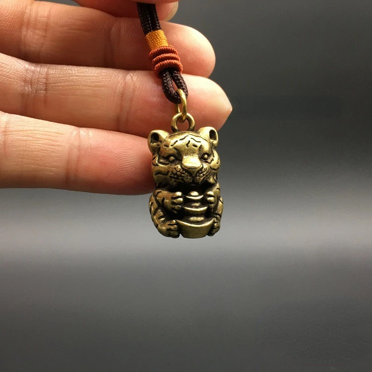 Solid brass small tiger pendant, holding gold ingots, tiger zodiac, tiger, cute copper tiger keychain pendant