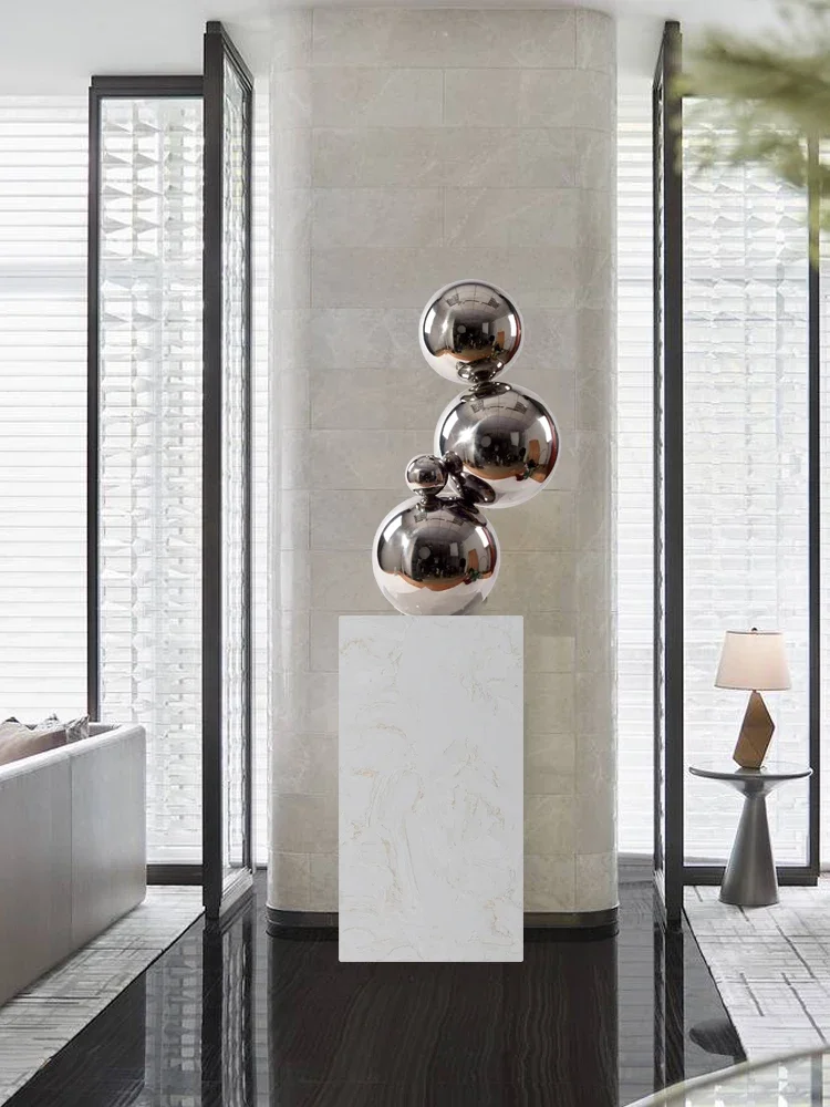 Modern simple creative stainless steel metal ball art sculpture. Villa hotel living room porch decoration.