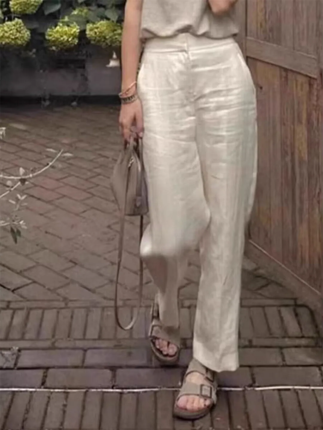 بنطلون نسائي واسع الساق بأسلوب ياباني عتيق، فضفاض وعملي، يمنح مظهراً نحيفاً، بخصر عالٍ وقماش كتان منسدل، قصة مستقيمة بطول تسع...