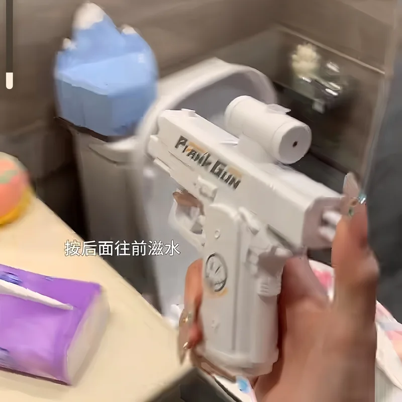 Pistolet à eau de farce, pistolet à eau bidirectionnel de farce – Spray auto-sousant avant et arrière, cadeau de Gag hilarant et jouet fantaisie pour les fêtes, l'été