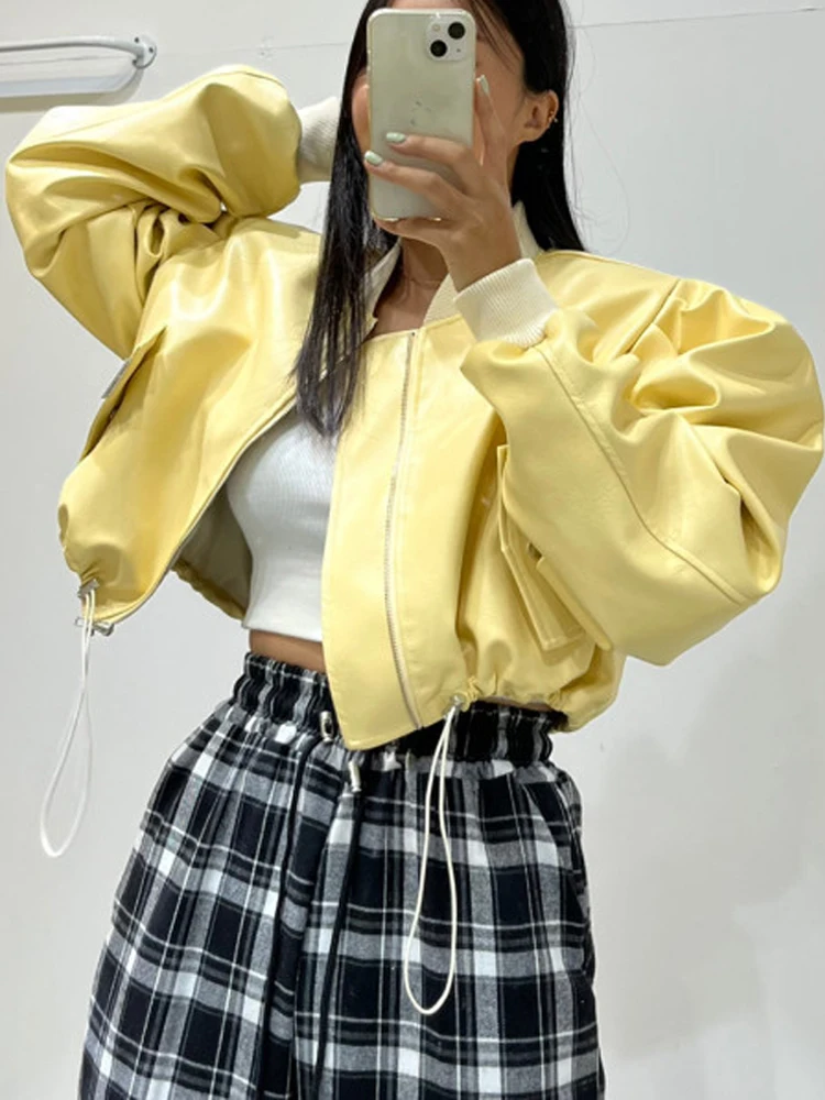 الأصفر بولي PU فو الجلود مثير اقتصاص سترات الربيع النساء 2025 موضة الوقوف كم طويل الرباط زمم موتور منفذها معاطف #1