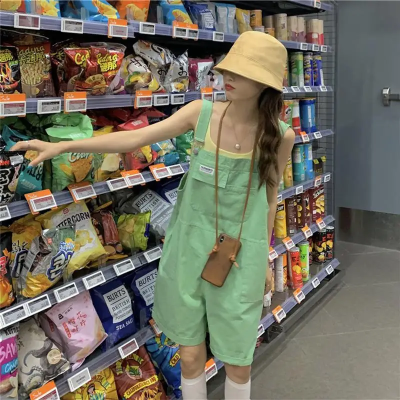 Damskie kombinezony, eleganckie czarne kombinezony, codzienne kombinezony jeansowe, czerwone zimowe bezrękawniki, szykowne niebieskie długie kombinezony imprezowe, duże rozmiary.