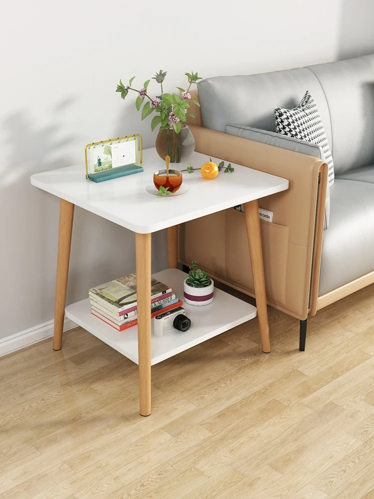 

A few living rooms, square tables, bedrooms, bedside racks near the coffee table and sofa in the rental house