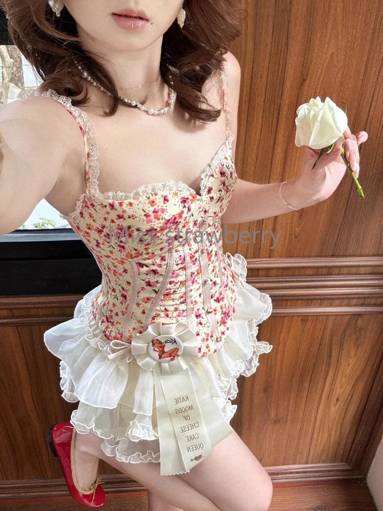 フランスヴィンテージスリムプリントスリング 2 点セット女性のファッションエレガントなオフショルダーノースリーブベスト女性デザインショートスカートスーツ