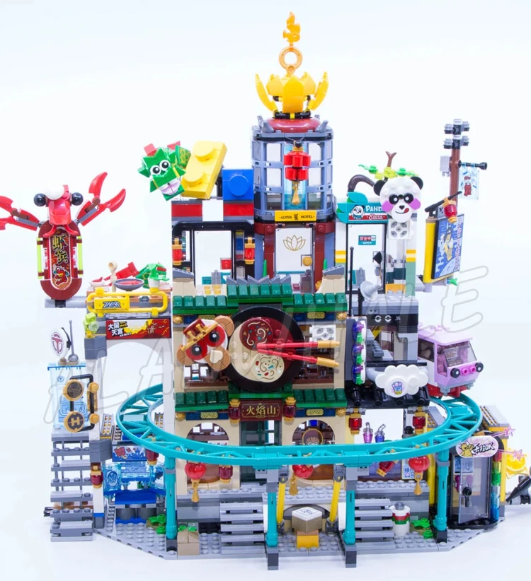 2187pcs Monkie Kid City of Lanterns Lotus Hotels Panda Shops Transit Train 86999 Building Blocks Toys Compatible With Model