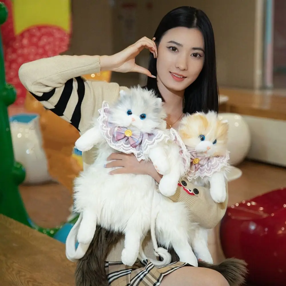 ผมยาวปุยตุ๊กตาแมวกระเป๋าเป้สะพายหลัง Super สมจริง Bow Tie ตุ๊กตาแมวกระเป๋าเป้สะพายหลังสายคล้องไหล่ที่ถอดออกได้การ์ตูน