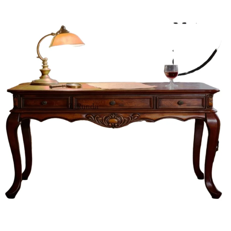 A 63-inch cherry wood desk with a herringbone pattern carved on the top and three drawers