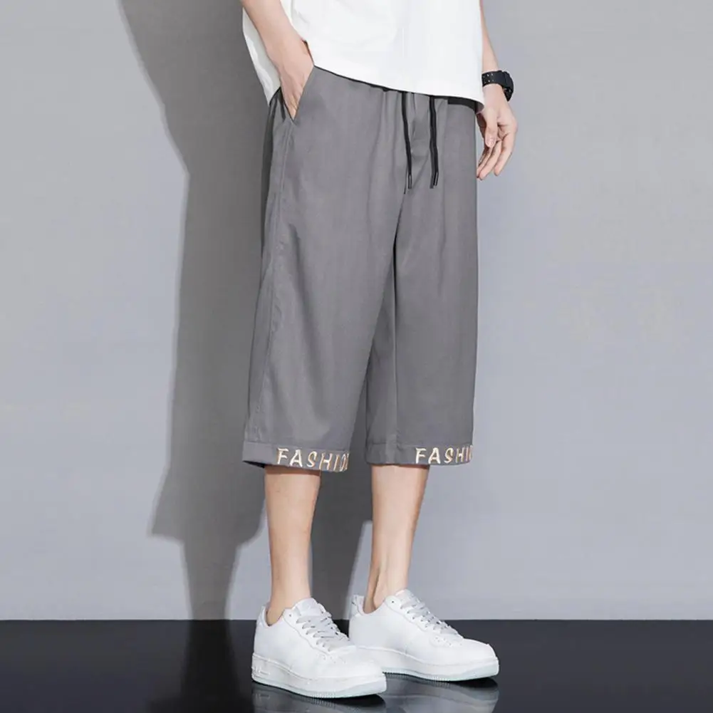 Zippered Pocket Trousers Stylish Men's Cropped Pants with Elastic Waistband Drawstring Featuring Letter Embroidery for Casual