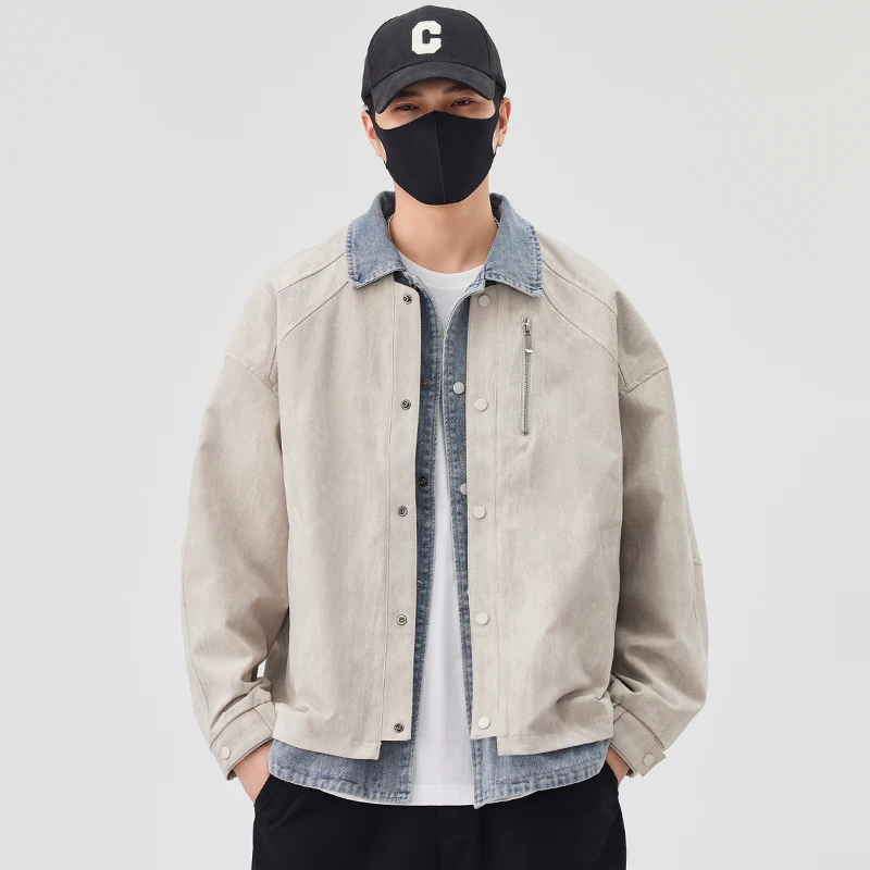 2025 primavera y otoño nueva chaqueta vaquera de dos piezas falsa de color blanco roto chaqueta negra informal versátil de moda para hombres