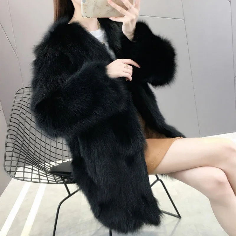 This is a women's fur coat with light and long collar