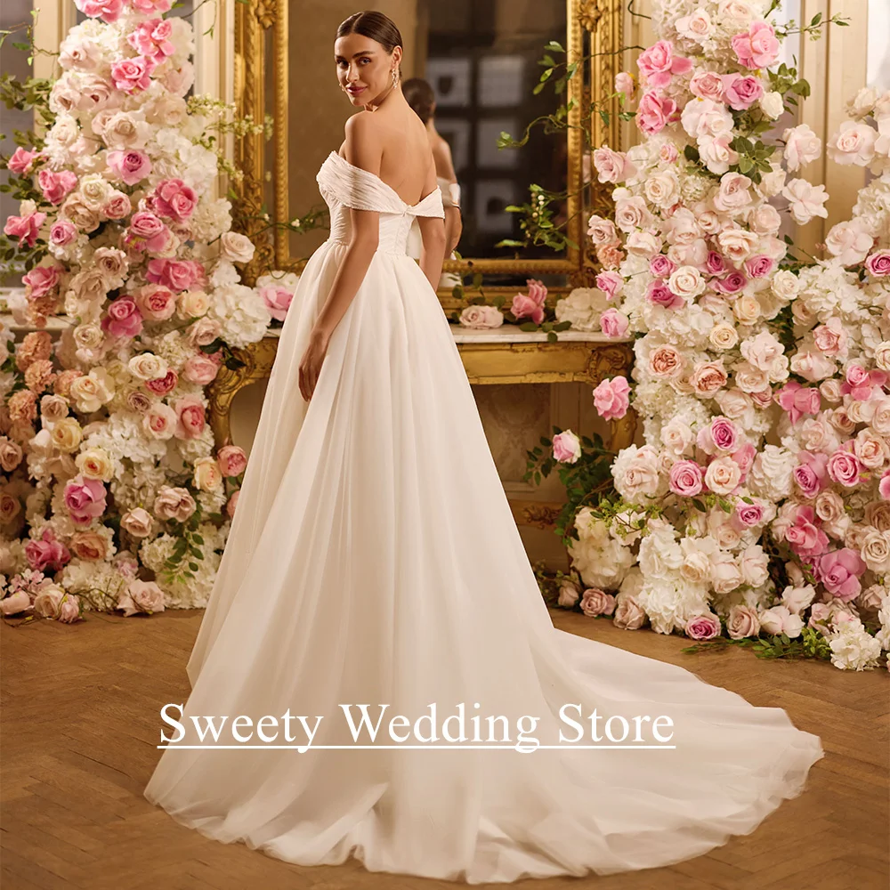 فستان زفاف من Vestidos De Novia مخصص قبالة الكتف ورقبة على شكل V لؤلؤ مطرز على شكل حرف A سويب تراين ناعم من التل فستان العروس