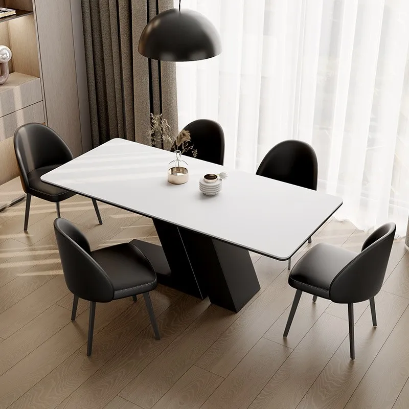

High-end dining table and chairs 2025 new rock slab modern dining table light luxury high-end small apartment black dining table