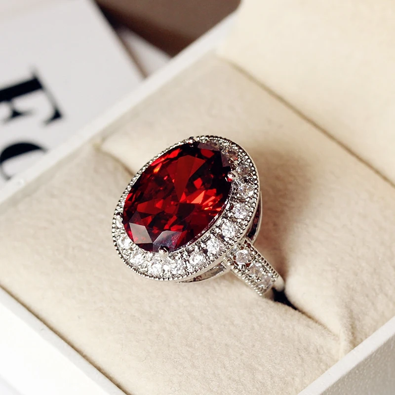 Bague ovale de luxe pour homme et femme, avec un grand pendentif, de couleur argentée, ornée d’une pierre rouge, idéale comme bague de fiançailles ou de mariage pour hommes et femmes.