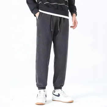 Jesień Zima Mężczyźni Plus Velvet Grube spodnie z polaru Solidna elastyczna talia Kieszenie ze sznurkiem Trend Moda Casual Luźne spodnie dresowe