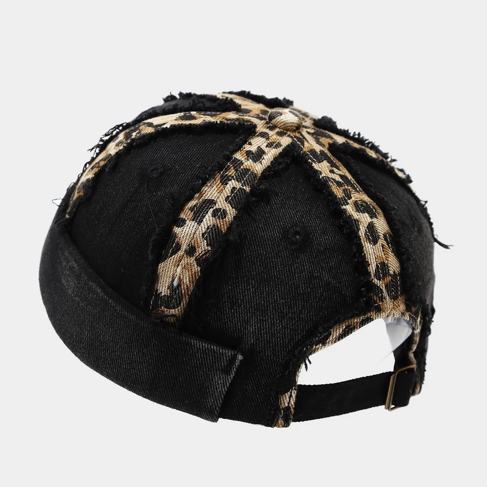 A trendy and stylish bohemian hat featuring a personalized leopard print fabric strip, distressed top hat brim with rolled edges