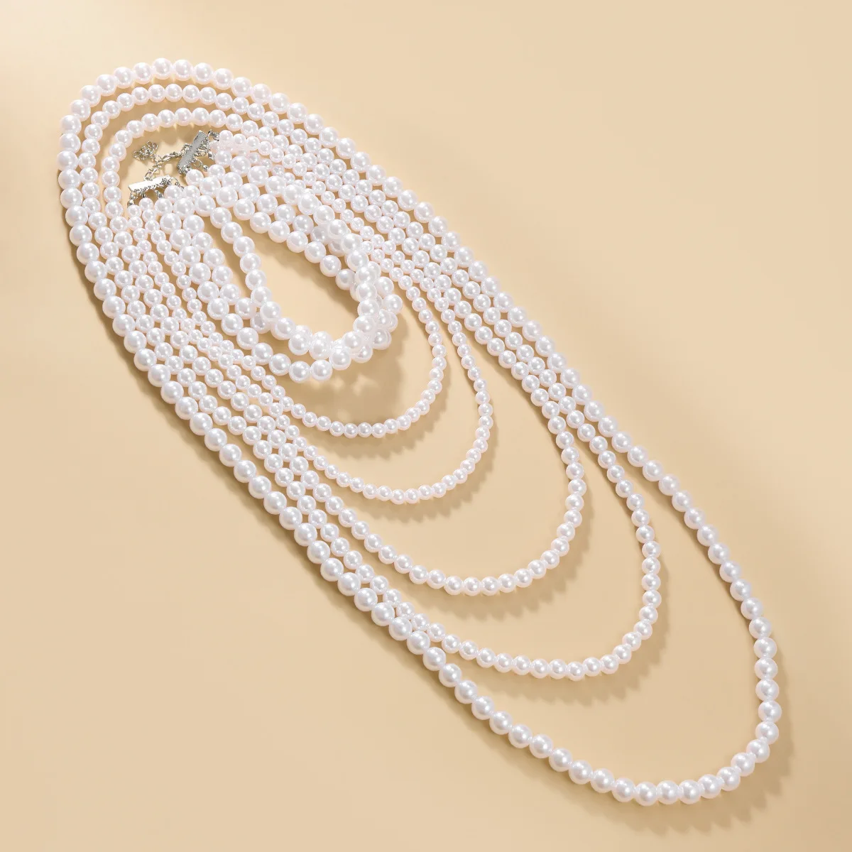 

New multi-layer long pearl necklace four-piece set, women's banquet accessories, European and American sweater chain wholesale