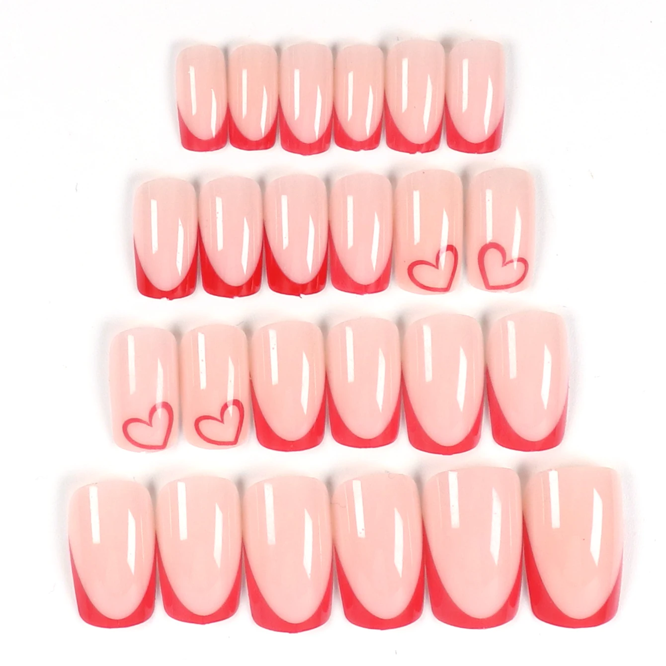 24 個の赤いハート型の付け爪セットと取り外し可能なキューティクル プッシャー 1 個で外観を瞬時にアップグレードします。
