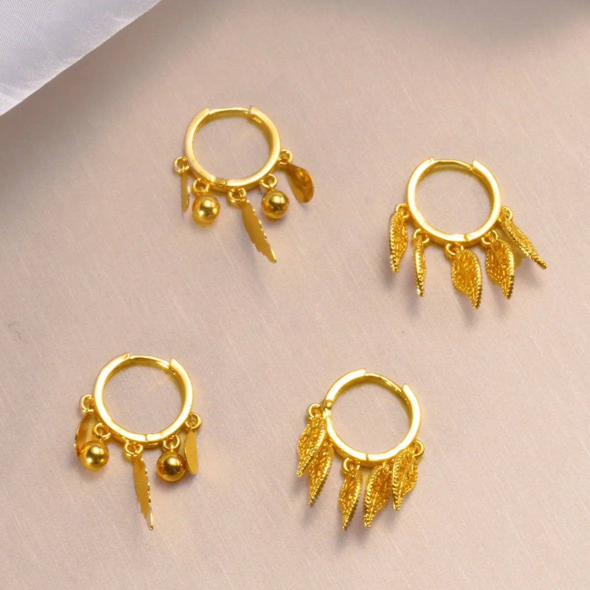 9999 gold Bohemian leaf fringed ear stud earrings - stylish, simple, unique, Korean-style, with a sophisticated design