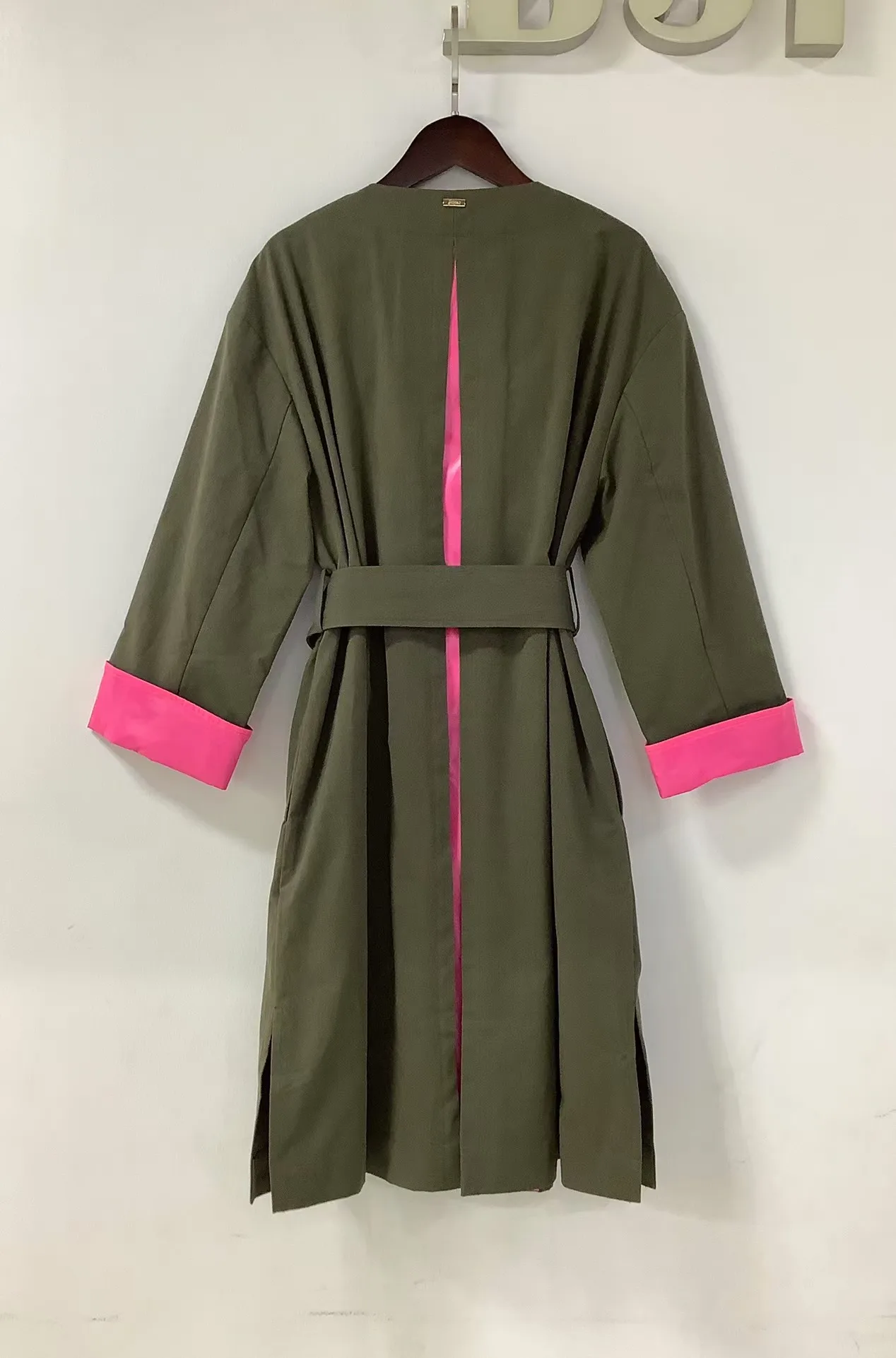 Hello, new color blocked commuting jacket with a cinched waist and long length