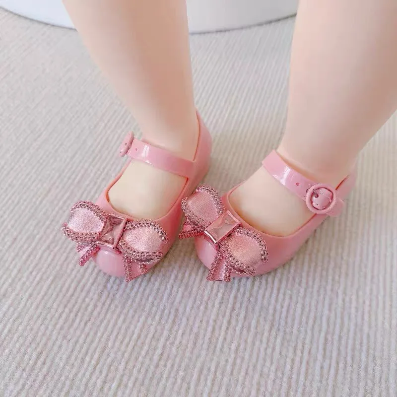 Mini Melissa sandali estivi per ragazze fiocco antiscivolo suola morbida Versatile solido coreano bambini dolci scarpe da principessa sandali da