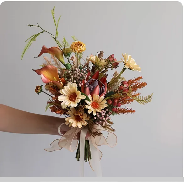 Licensing photo holding flowers autumn and winter color artificial flowers wedding photography artifact desktop ritual decoratio