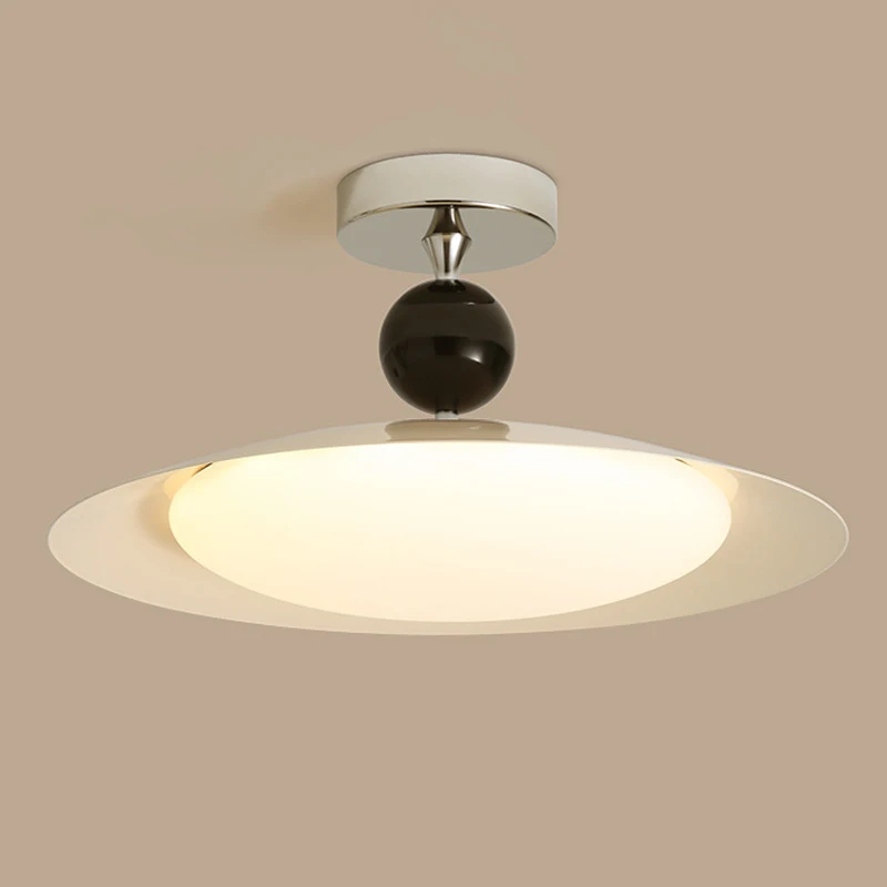 

The Ceiling Lamp In The Master Bedroom Features a Retro Flying Saucer And Walnut Wood Grain Design. The Study Lamp Is In a New