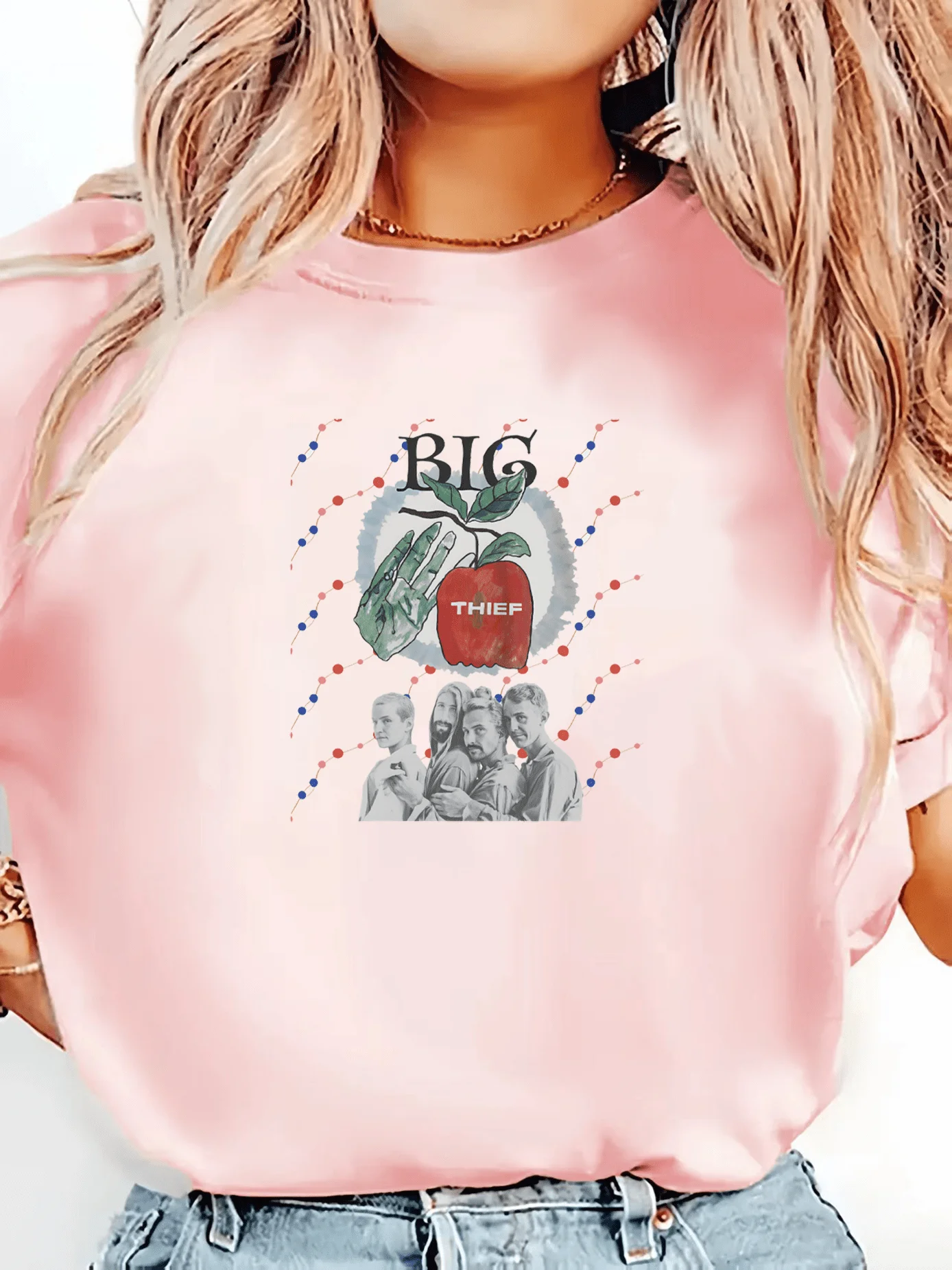 Women's fashion T-shirt featuring hand-drawn apple and palm motifs inspired by the band's album *Two Hands*.
